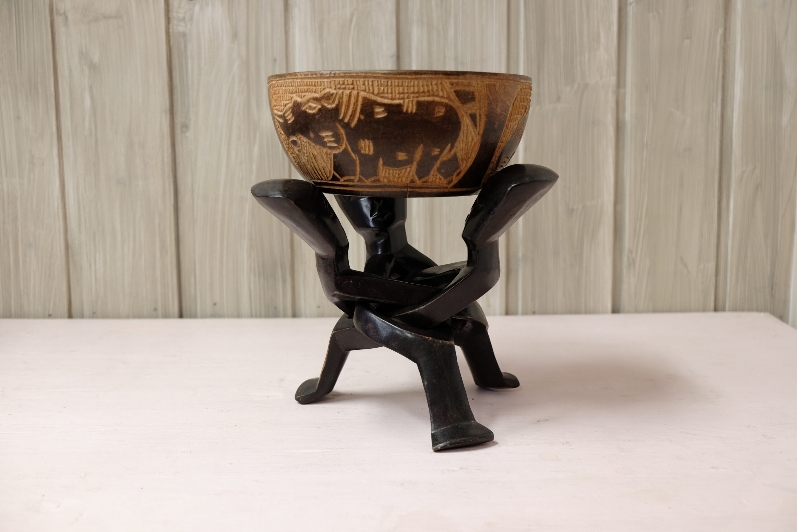 Ebony wooden bowl with intertwined sculptures